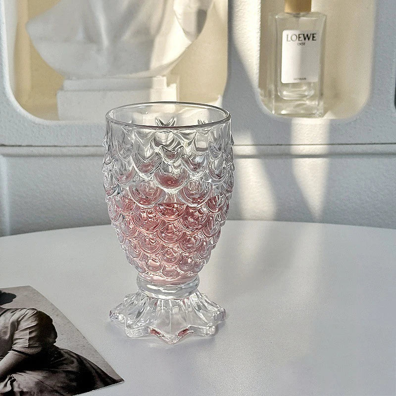 Domani Fish Glass Set – set of four 6-ounce clear glasses with a unique fish scale texture, perfect for serving cocktails, juice, or stylish drinks with whimsical elegance.
