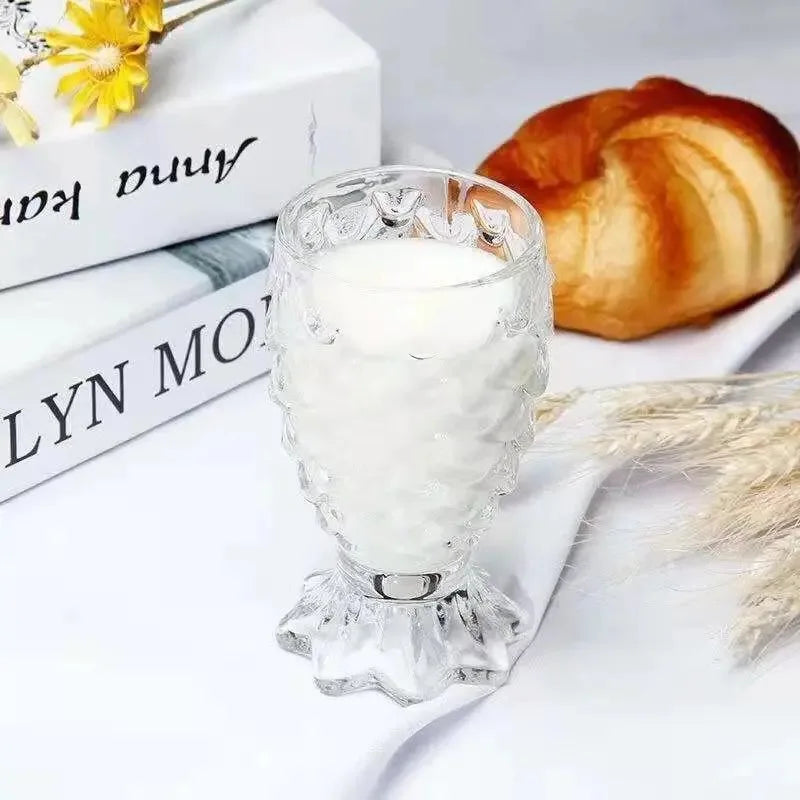 Domani Fish Glass Set – set of four 6-ounce clear glasses with a unique fish scale texture, perfect for serving cocktails, juice, or stylish drinks with whimsical elegance.