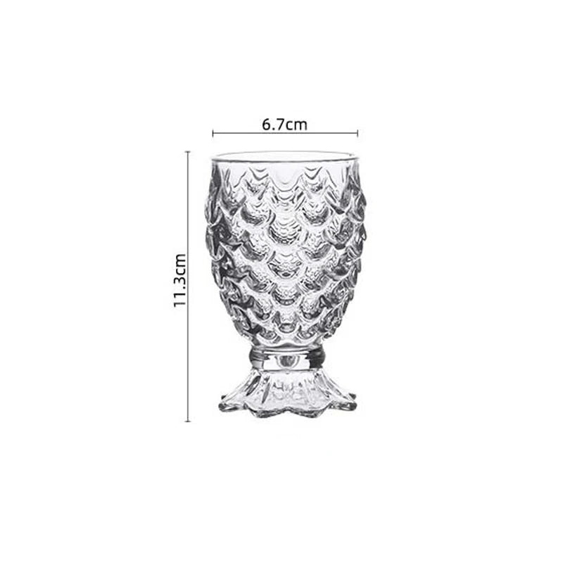 Domani Fish Glass Set – set of four 6-ounce clear glasses with a unique fish scale texture, perfect for serving cocktails, juice, or stylish drinks with whimsical elegance.