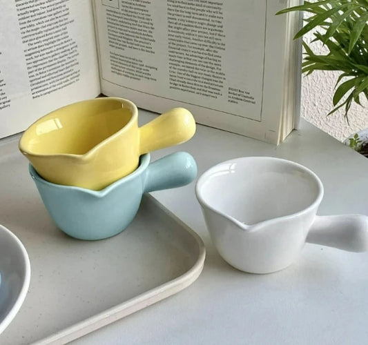 Stylish ceramic creamer holds 2.7oz, perfect for coffee bar & sauces in three chic colors.