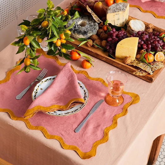 Image of the Paloma Placemat featuring a rectangular shape with a charming scalloped edge, designed for home décor enthusiasts. Made from a durable cotton double layer, it measures 35 x 50 cm and is available in four stylish colorways. Ideal for decorating dining tables with elegance and sophistication.