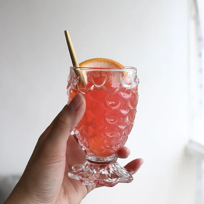 Domani Fish Glass Set – set of four 6-ounce clear glasses with a unique fish scale texture, perfect for serving cocktails, juice, or stylish drinks with whimsical elegance.