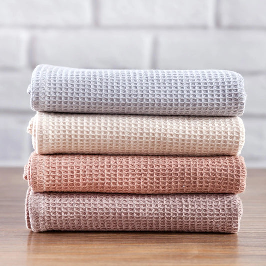 Set of four waffled cotton kitchen towels, measuring 35x35 cm each, in a range of versatile colorways. These high-quality, lightweight towels are designed for everyday use, providing excellent absorbency and durability. Ideal for home décor enthusiasts who value both functionality and style in kitchen essentials.