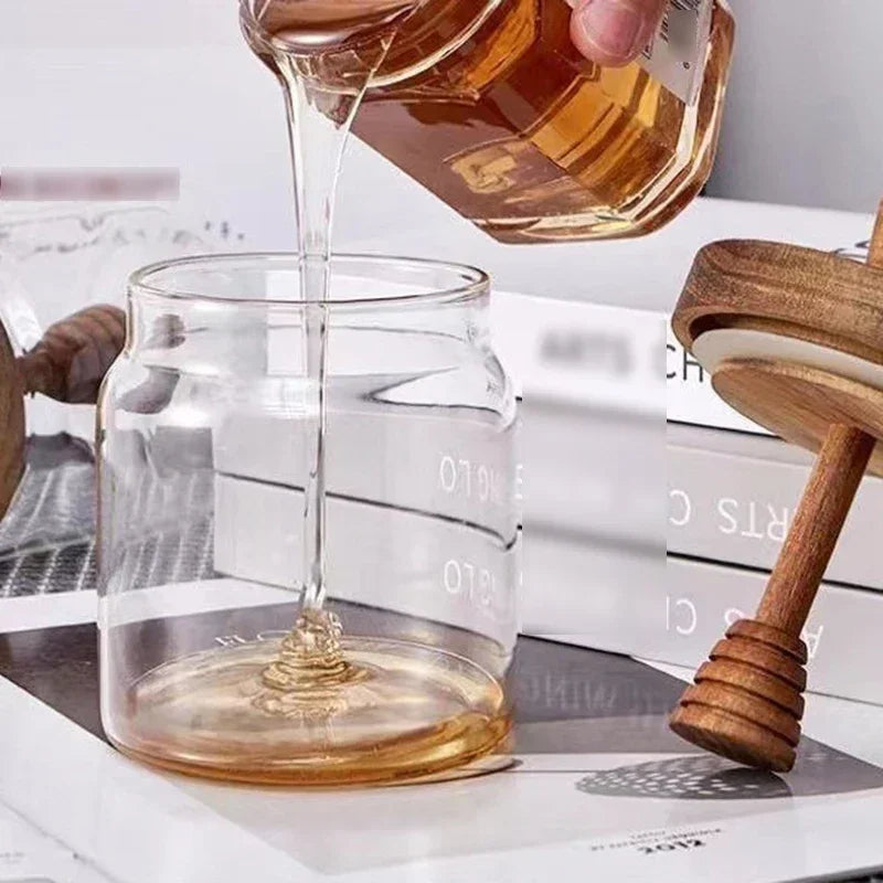 Fivel Honey Jar – elegant high borosilicate glass jar with a sealed storage design, wooden lid, and dip stick, perfect for keeping honey fresh and stylishly serving it.