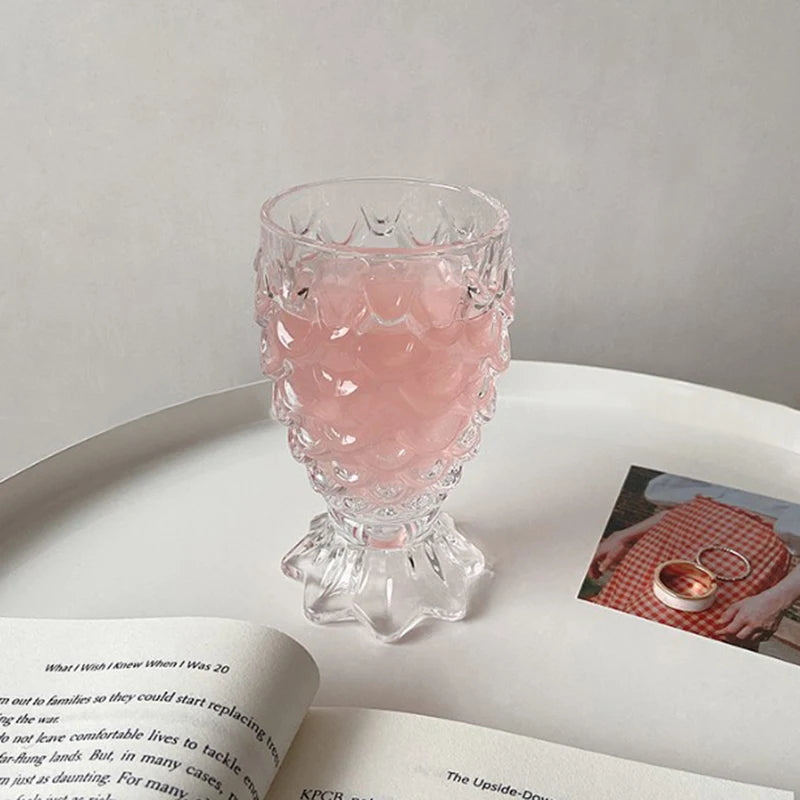 Domani Fish Glass Set – set of four 6-ounce clear glasses with a unique fish scale texture, perfect for serving cocktails, juice, or stylish drinks with whimsical elegance.